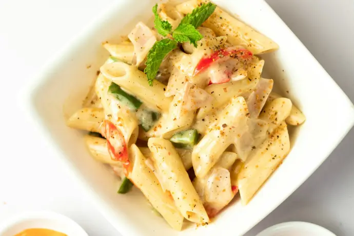 Penne pasta dish with sauce in a bowl